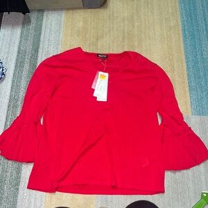 Red sweater with pleated sleeve cuffs